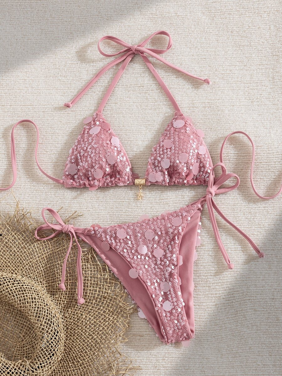 Beige Y2K triangle bikini set featuring a deep V-neck halter top with knot details and removable padding paired with low waist cheeky bottoms.