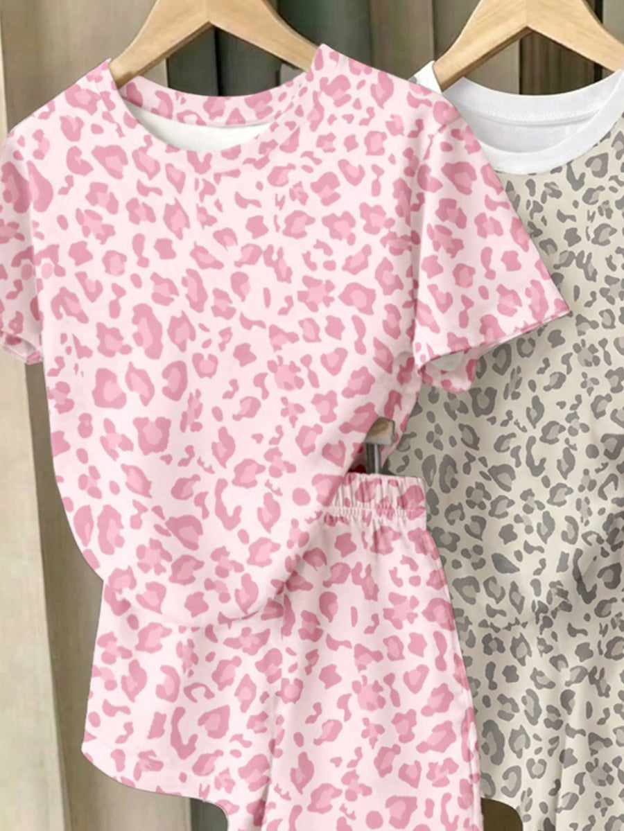 Girls' multicolor short sleeve T-shirt and shorts set featuring a cute cherry and bow print with round neck top and matching shorts.